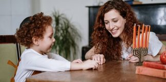 Mother and Son With a Menorah