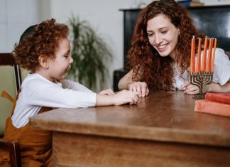 Mother and Son With a Menorah