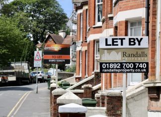 A sign on a city street Description automatically generated