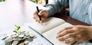 A picture containing text, person, table, indoor Description automatically generated