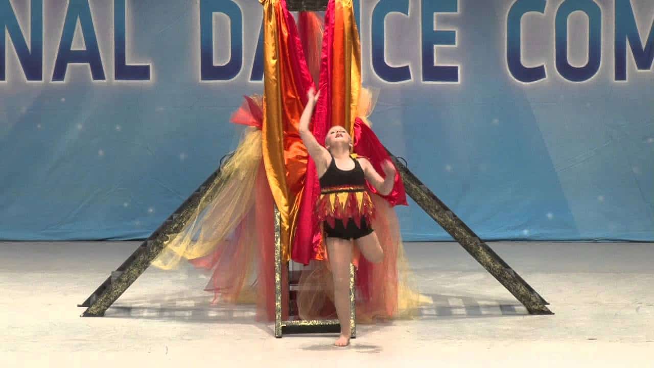 12 year old girl dances on one leg