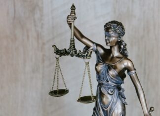 Different Types of Compensation from a Personal Injury Lawsuit woman holding sword statue during daytime