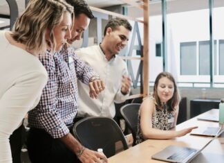 Employing Staff for the First Time: Remember These Points woman sitting at table
