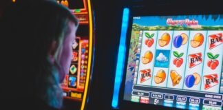 man playing slot machine game