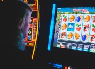 What makes a trusted online slot site? man playing slot machine game