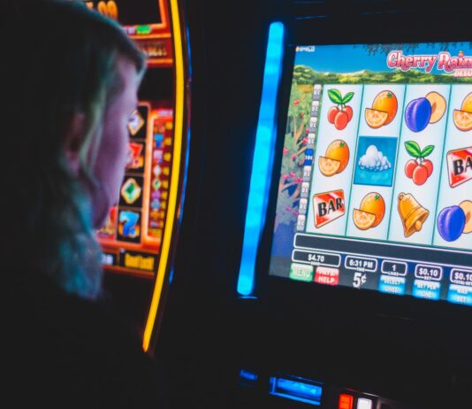 What makes a trusted online slot site? man playing slot machine game