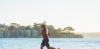 man running near sea during daytime