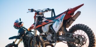 selective focus photography of two white and black dual-sport motorcycles