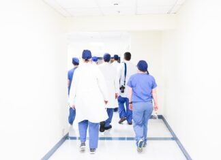 10 Reasons Why Having a Nursing Career Is a Smart Thing to Do group of doctors walking on hospital hallway