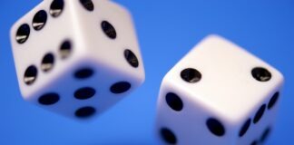 2 white dices on blue surface