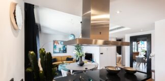 round white wooden table near kitchen island