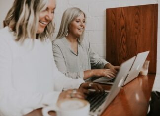 The Appeal of Online Bingo Amongst the Ladies two women using laptops
