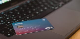 blue and white visa card on silver laptop computer