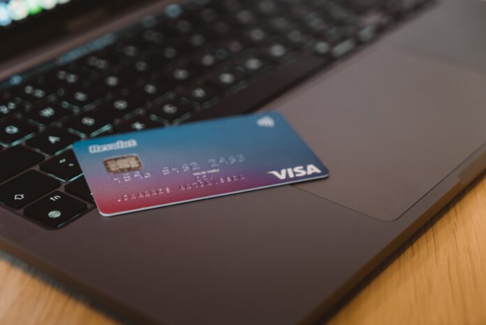 Photo by CardMapr blue and white visa card on silver laptop computer