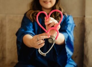 Questions About Job Duties as an LTAC RN in Louisiana girl in blue jacket holding red and silver ring