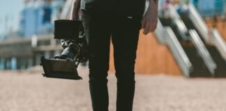 person holding shoulder-mount camcorder