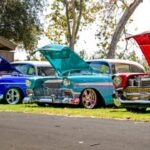 7 Signs That Your Car Battery Is Declining three red, blue, and teal classic cars