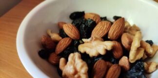 brown and black nuts on white ceramic bowl