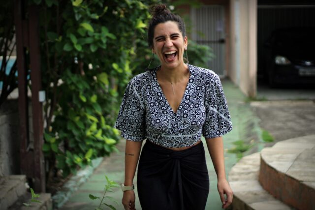 woman smiling in open area
