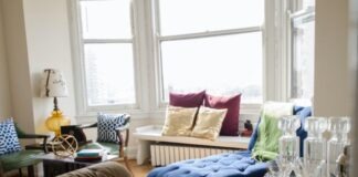 blue and white sofa with throw pillows