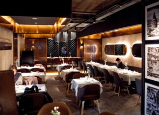 Things to Consider When Buying and Arranging Restaurant Furniture person sitting at the corner of the room