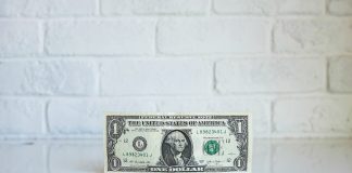 1 U.S. dollar banknote on white surface