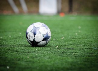 How can you choose the right platform for online football betting, and what are the benefits? white and blue soccer ball on green grass field during daytime