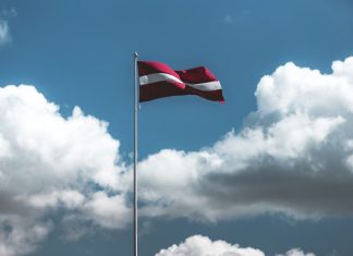 Latest Trends of Bitcoin Trading in Latvia red and white striped flag