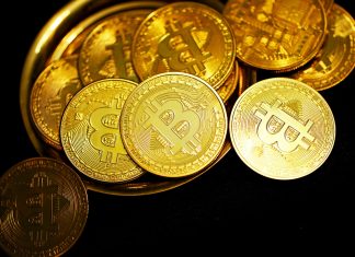 Latest Trends of Bitcoin Mining in Washington gold round coins on black surface