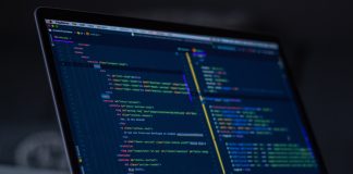 turned-on MacBook Pro wit programming codes display