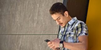 man holding Android smartphone