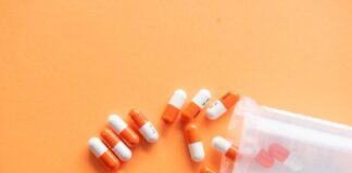 orange and white medication pill
