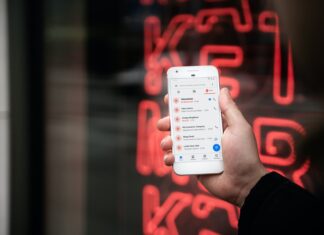 Use the scam verification site wisely person holding white samsung galaxys 4
