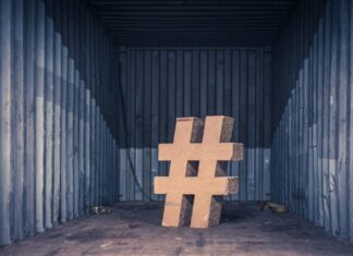 Best Instagram Hashtag Generator Tools brown ampersand concrete statue inside an intermodal container