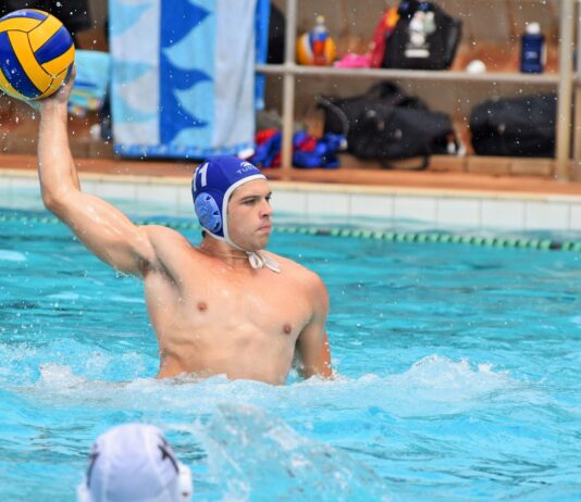 man in blue swimming goggles
