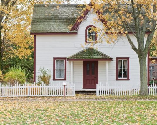white house under maple trees
