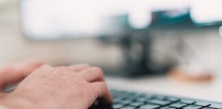 person using black computer keyboard