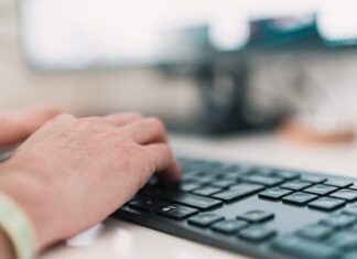 Do Businesses Need Workers Comp Insurance For Remote Workers? person using black computer keyboard