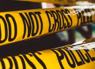 Who Is Responsible for Calling Out a Trauma Cleaner? do not cross police barricade tape close-up photography