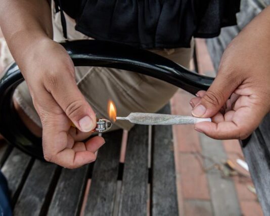 person holding silver and black lighter
