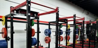 three red barbell machines