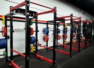three red barbell machines