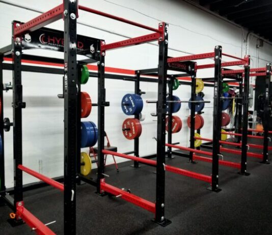 three red barbell machines