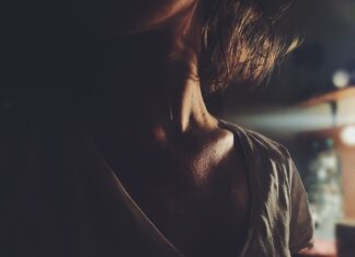 How To Become More Sexually Confident woman standing near brown wooden table