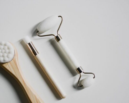 silver spoon and fork on white surface