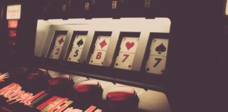 a slot machine with playing cards on it