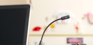 black and brown headset near laptop computer