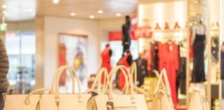 shallow focus photo of white leather handbags on table