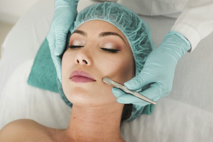 Photo by karelys Ruiz woman doing liposuction on her face