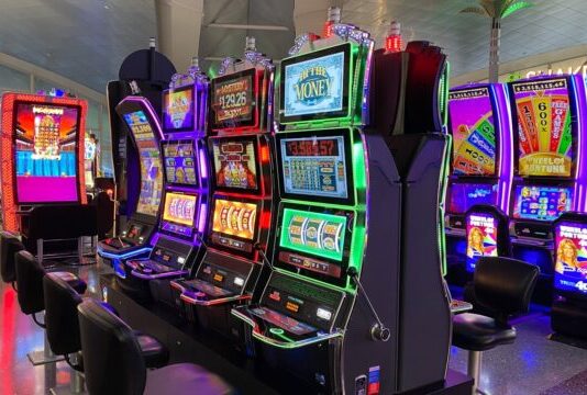 empty chairs in front of arcade machines